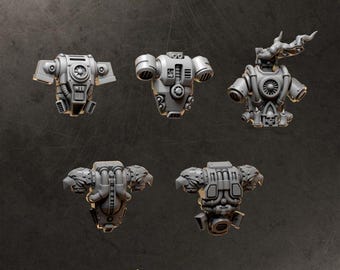 May include: Five grey resin miniature backpacks for tabletop gaming figures. The designs include mechanical vents, turbine details, eagle motifs, and a skull emblem with smoke effects. The text BACKPACKS and GREYTIDE STUDIO is visible.