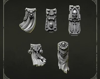 May include: A set of five grey miniature resin loincloths labeled Loincloths 1. Each piece features intricate sculpted details including skulls, chains, feathers, and a sword emblem. These decorative components are designed for tabletop gaming figures.