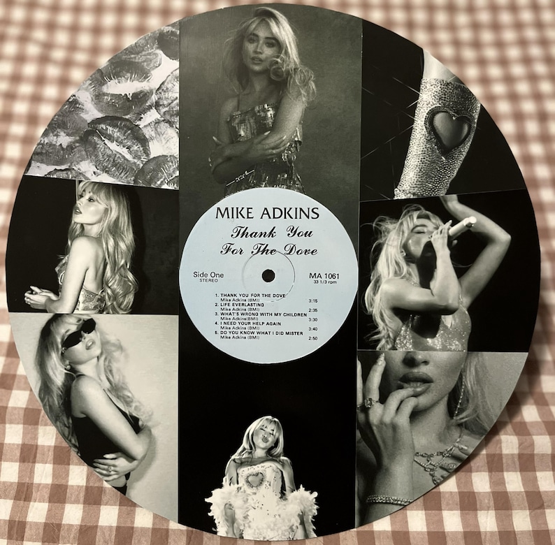 May include: A black and white collage featuring a vintage vinyl record with the text "MIKE ADKINS Thank You For The Dove." The record is surrounded by black and white images of a woman. The collage includes images of lips and a bejeweled arm.