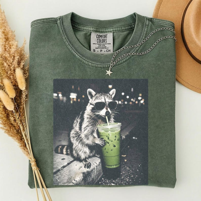 Comfort Colors Raccoon Drinking Iced Matcha Shirt, Retro Prehistoric ...