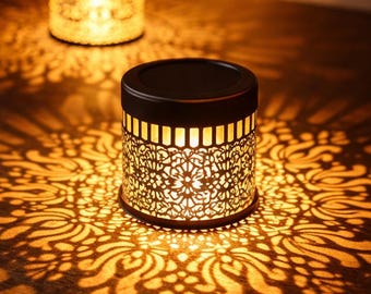 Solar lantern with floral projection – Decorative warm LED light for garden, patio and outdoor use