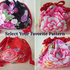 May include: Four drawstring pouches featuring floral patterns in black, pink, red, and white with thick red rope closures. The text Select Your Favorite Pattern is centered between the bags. Each pouch has a gathered top and a rounded base.