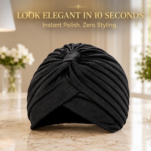 May include: A solid black turban featuring a gathered, pleated design with a central knot detail. The text above the item reads: LOOK ELEGANT IN 10 SECONDS. Instant Polish. Zero Styling.