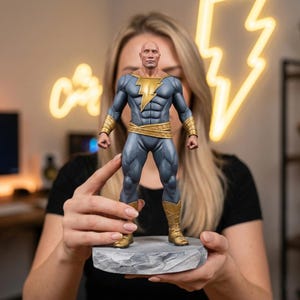 May include: A detailed figurine of a superhero in a gray and gold costume, standing on a gray stone base. The figure has a muscular physique and a lightning bolt emblem on the chest. The background features a neon lightning bolt.