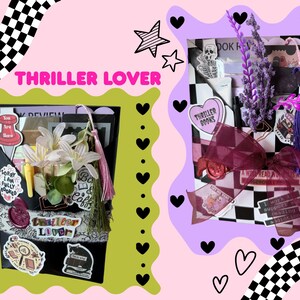 May include: Two gift boxes with a thriller theme. One box is black with stickers and white flowers. The other box is black and white checkered with a burgundy bow and purple flowers. The text "Thriller Lover" is visible.