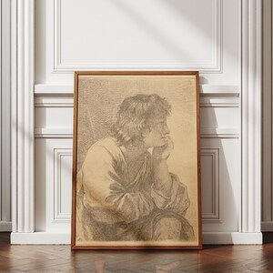 May include: A rectangular wooden frame containing a sepia-toned sketch of a person with wavy hair, shown in profile, resting their chin on a hand. The artwork features detailed cross-hatching and line work, depicting a figure in draped clothing.