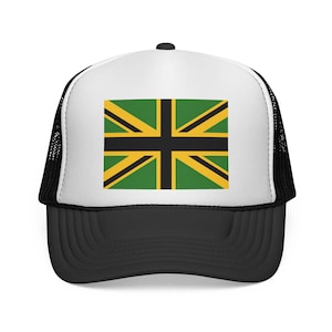May include: A black and white trucker hat with a white front panel featuring a green, black, and yellow flag design. The hat has a curved brim and a mesh back for breathability.