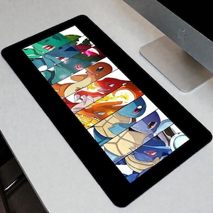 May include: A rectangular desk mat with a black border featuring a vertical sequence of illustrated characters. The design displays the evolutionary stages of three creatures in green, orange, and blue color palettes, including fire and water effects.