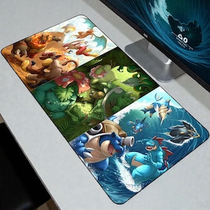May include: A rectangular desk mat featuring a vibrant, multi-paneled illustration of various creatures. The top section displays fire-type creatures in a desert, the middle shows grass-type creatures in a forest, and the bottom depicts water-type creatures.
