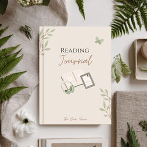 May include: A cream-colored reading journal with a hard cover featuring the text Reading Journal and The Book Haven. The cover design includes illustrations of a book, an e-reader, headphones, green leaves, and a small butterfly.
