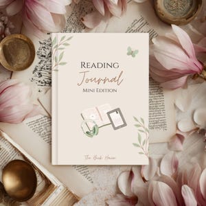 May include: A cream-colored journal titled Reading Journal MINI EDITION with a small green butterfly, green leaf illustrations, and a central graphic showing an open book, a tablet, and green headphones, with the text The Book Haven at the bottom.