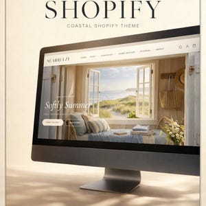 May include: A computer monitor shows a website with the text "SHOPIFY COASTAL SHOPIFY THEME". The website has a coastal theme with the text "SEABREEZE" and "Softly Summer". The image shows a window overlooking a beach scene.