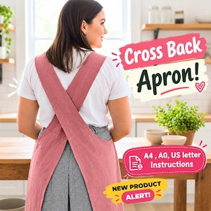 Puede incluir: Un delantal de color rosa empolvado con espalda cruzada sobre una camiseta blanca y pantalones de rayas negras y blancas. El texto en la imagen dice: Cross Back Apron!, A4, A0, US letter Instructions y NEW PRODUCT ALERT!
