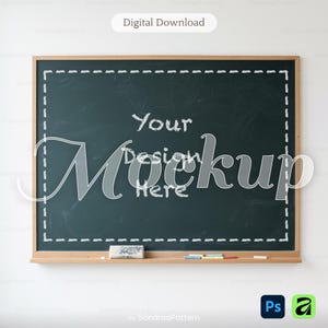 May include: A rectangular dark green chalkboard with a light wooden frame. The board features a white dashed border and the text Your Design Here. A white eraser and four small pieces of colored chalk rest on the bottom wooden ledge.