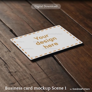 May include: A white business card mockup with the text "Your design here" in a gold color, set against a dark wood background. The card has a dashed border and the words "Digital Download" are at the top.