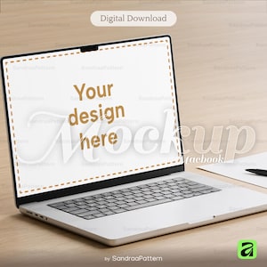 May include: A silver laptop computer with a black keyboard and a white screen displaying the text "Your design here Mockup". The image also includes a pen and paper, and the words "Digital Download".