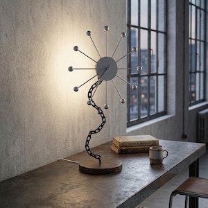 May include: A set of three ceramic mugs with a speckled, matte finish. The mugs are in shades of cream, light gray, and dark gray. Each mug has a simple, minimalist design and a rounded handle.