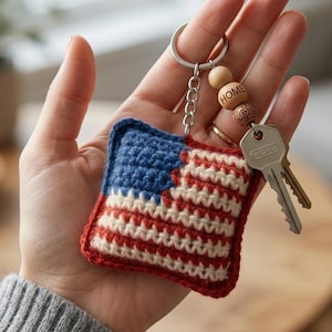 May include: A white ceramic mug with a black handle and the text "But First, Coffee" in a black, handwritten-style font. The mug is on a white surface.