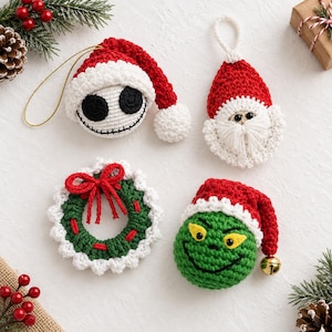 May include: Four handmade crochet Christmas ornaments including a white skull with a red Santa hat, a Santa Claus face with a white beard, a green wreath with a red bow, and a green character head with a red hat and a small gold jingle bell.