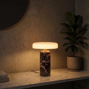 May include: A set of three ceramic vases in varying heights and shapes. The vases are glazed in a matte white finish, offering a minimalist aesthetic. The tallest vase is approximately 10 inches high.