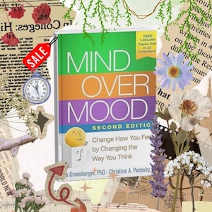 May include: A book titled Mind Over Mood Second Edition by Dennis Greenberger and Christine A. Padesky. The cover features a yellow circular face emerging from a white box, with text stating Over 1,300,000 Copies Sold in 23 Languages.