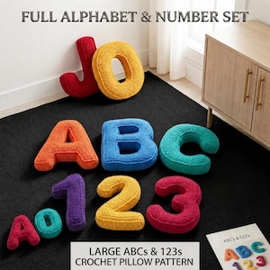 May include: A set of crochet pillows shaped like letters and numbers in various colors including red, yellow, orange, blue, and teal. The text FULL ALPHABET & NUMBER SET and LARGE ABCs & 123s CROCHET PILLOW PATTERN is visible in the image.