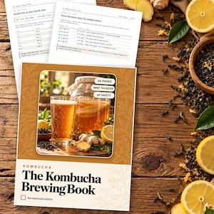 May include: A digital guide titled The Kombucha Brewing Book featuring 20 pages of instructions, sweet tea ratios, and pH safety information. The cover displays a glass of kombucha, ginger, and lemon. Includes two reference sheets for brewing.