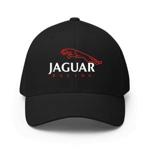 May include: Black baseball cap featuring the Jaguar logo in red and the word "JAGUAR" in white, with "RACING" in red beneath. The cap has a curved brim and a structured fit, suitable for various outdoor activities.