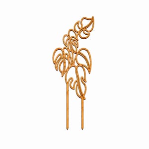 May include: A light brown wooden plant trellis featuring a cutout design of monstera leaves. The structure consists of a decorative upper section with multiple leaf shapes and two straight, pointed stakes at the bottom for insertion into soil.