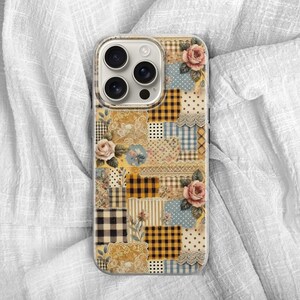 May include: A clear phone case with a patchwork design. The design features floral patterns, gingham, polka dots, and lace in shades of beige, yellow, blue, and pink. The case has a clear border and a camera cutout.