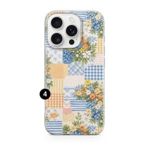 May include: A phone case with a patchwork design featuring floral and gingham patterns in shades of blue, yellow, and orange. The case has a white border and a camera cutout.