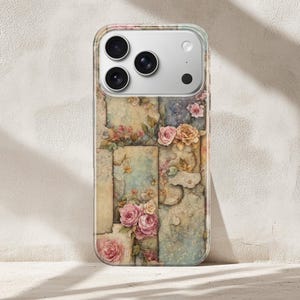 May include: A clear phone case with a floral pattern of pink and yellow roses, set against a backdrop of faded, textured panels in muted tones. The case has a clear border and a camera cutout.