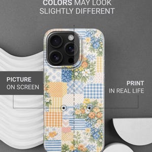 May include: A phone case with a patchwork design featuring floral and geometric patterns in yellow, blue, and orange. The case has a clear border and text that reads "THIS IS DURABLE UV PRINT" and "COLORS MAY LOOK SLIGHTLY DIFFERENT."