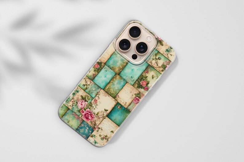 May include: A phone case with a patchwork design in teal, cream, and green squares. The squares are decorated with floral and botanical illustrations, including pink roses. The case has a clear border and a camera lens cutout.