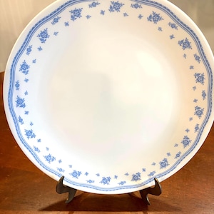 May include: A set of three ceramic mugs with a speckled, matte finish. The mugs are in shades of cream, light gray, and dark gray. Each mug has a simple, minimalist design, perfect for coffee or tea.