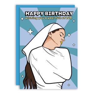 May include: Birthday card with a pop art style illustration of a person wearing a white head covering and a white top. The card has the text "HAPPY BIRTHDAY wishing you a year full of LUX" on a blue background with star accents.