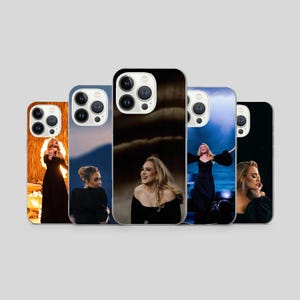 May include: A white ceramic mug with a black handle and the text "But First, Coffee" in a bold, black font. The mug is filled with a dark liquid, likely coffee, and sits on a light-colored surface.