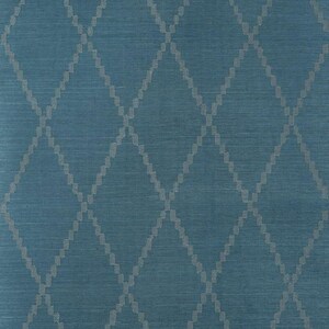 May include: Close-up of a blue fabric with a diamond pattern. The diamonds are formed by a series of small, light gray rectangles. The background is a solid, medium blue color. The fabric has a textured appearance.