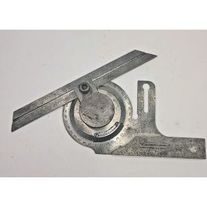 May include: A vintage metal protractor tool with a rotating arm and a circular scale marked from 0 to 90 degrees. The base features engraved text reading Brown & Sharpe Mfg. Co., Providence, R.I., U.S.A. and the number 496, with a weathered finish.