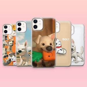 May include: Five iPhone cases showcasing the animated character Bolt. The cases feature different images of the white dog, including close-ups and action poses. The cases have a glossy finish and are set against a pink background.