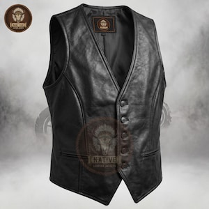 May include: A black leather vest with a V-neck and button closure. The vest has two front pockets and a tailored fit. The Native Leather Jackets logo is visible on the upper left and lower center of the vest.