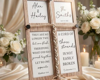 May include: A wooden wedding sign with four framed sections. The top frames display names and a date, while the bottom frames feature Bible verses. The sign is held together with rope and stands on a small wooden easel.