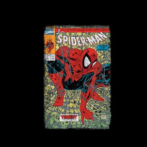 May include: Comic book cover showing Spider-Man in a red and black suit, posed within a web design. The title "Spider-Man" is visible, with text indicating a collector's item issue. The cover has a distressed, vintage appearance.