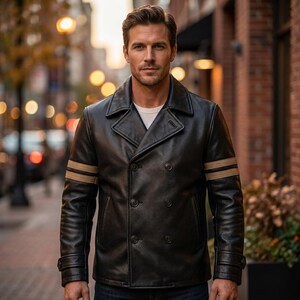 May include: A black leather jacket with a double-breasted design. The jacket has two tan stripes on the left sleeve and a notched collar. The jacket features two rows of buttons and a classic, tailored fit.