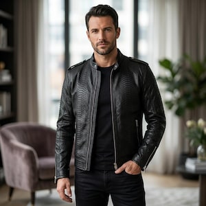May include: A black leather jacket with a snakeskin pattern, zip closure, and a stand-up collar. The jacket is worn with a black t-shirt and black jeans. The style is modern and sophisticated, suitable for various occasions.