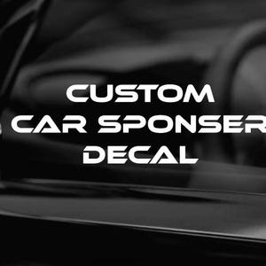 May include: Monochrome image of a car's exterior, featuring a side mirror and a portion of the interior. Bold white text reads "CUSTOM CAR SPONSOR DECAL", suggesting a product for vehicle customization. The overall aesthetic is sleek and modern.