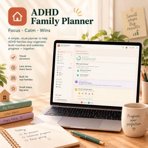 May include: A laptop displaying an ADHD Family Planner dashboard with a sidebar menu, task lists, and progress trackers. Beside it are three stacked notebooks, a spiral-bound planner with handwritten notes, a green pen, and a mug labeled Progress over perfection.