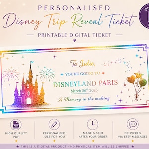 May include: A rectangular printable digital ticket featuring a rainbow-colored castle, fireworks, and balloons. The text reads: To Julie, YOU'RE GOING TO DISNEYLAND PARIS March 26th 2026 A Memory in the making. The border has a holographic foil effect.