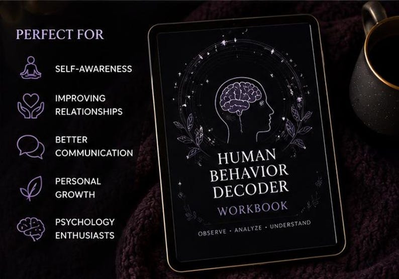 May include: A digital tablet displays the cover of the "Human Behavior Decoder Workbook." The cover is black with a brain and profile illustration. Text includes "Observe, Analyze, Understand." The tablet is next to a black mug with a gold rim.