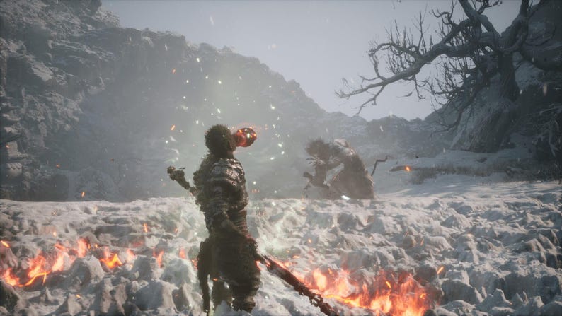 May include: A digital art scene depicts a warrior with a glowing head and weapon, facing a creature in a snowy, fiery landscape. The scene is set in a mountainous area with a barren tree.